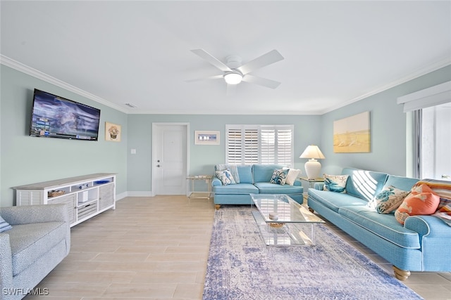 living room featuring light hardwood / wood-style floors, ceiling fan, and ornamental molding