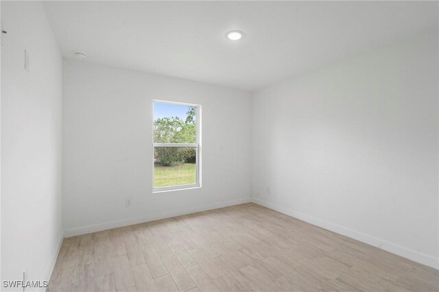 spare room featuring light hardwood / wood-style flooring