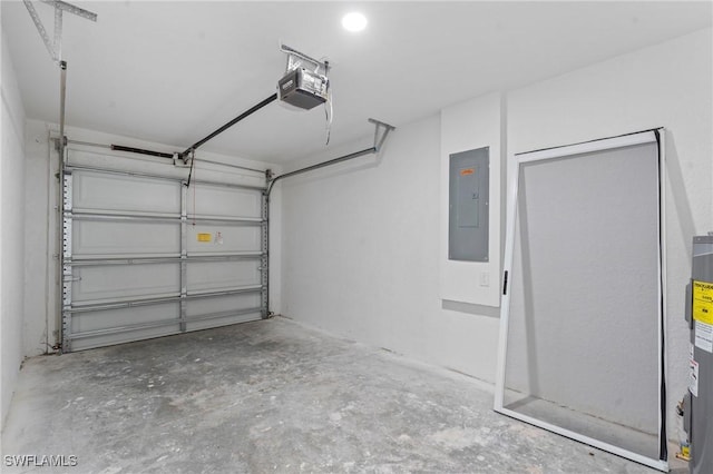 garage featuring a garage door opener and electric panel