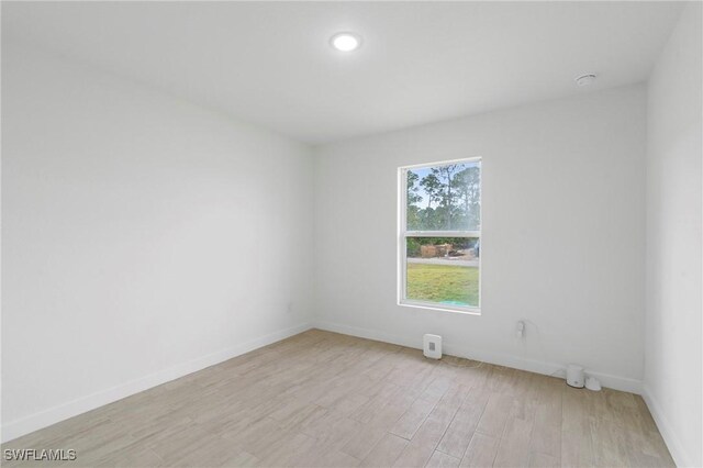 spare room with light hardwood / wood-style floors