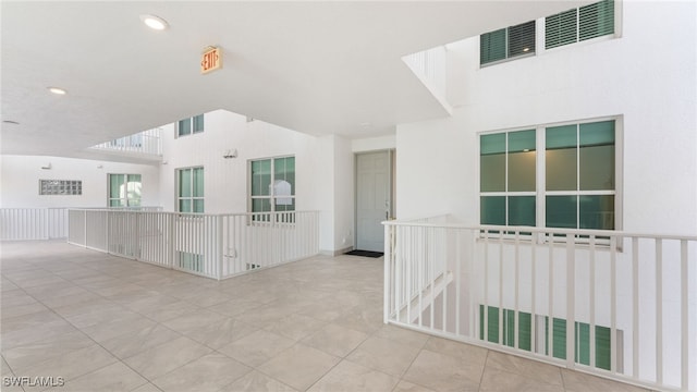 unfurnished room featuring tile patterned flooring, visible vents, and recessed lighting