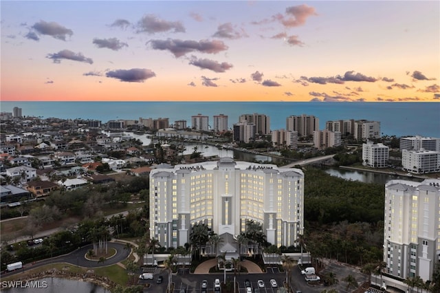 aerial view at dusk with a water view