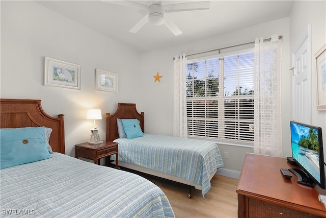 bedroom featuring ceiling fan and light hardwood / wood-style floors