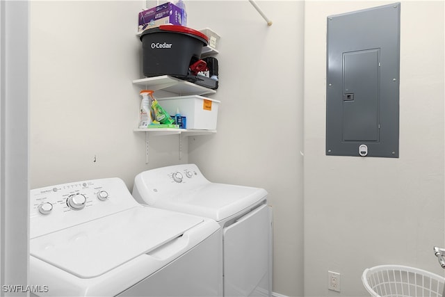 clothes washing area with electric panel and washing machine and clothes dryer