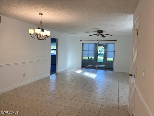 7050 Nantucket Cir Unit 4, North Fort Myers, FL 33917 - spare room with plenty of natural light, light tile patterned flooring, a textured ceiling, and a chandelier