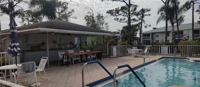 7050 Nantucket Cir Unit 4, North Fort Myers, FL 33917 - community pool featuring a patio area, a ceiling fan, outdoor dining space, and a gazebo