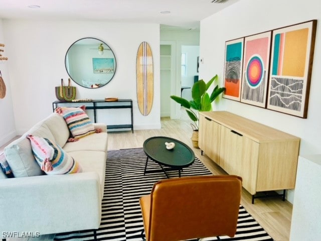 living room with light hardwood / wood-style flooring