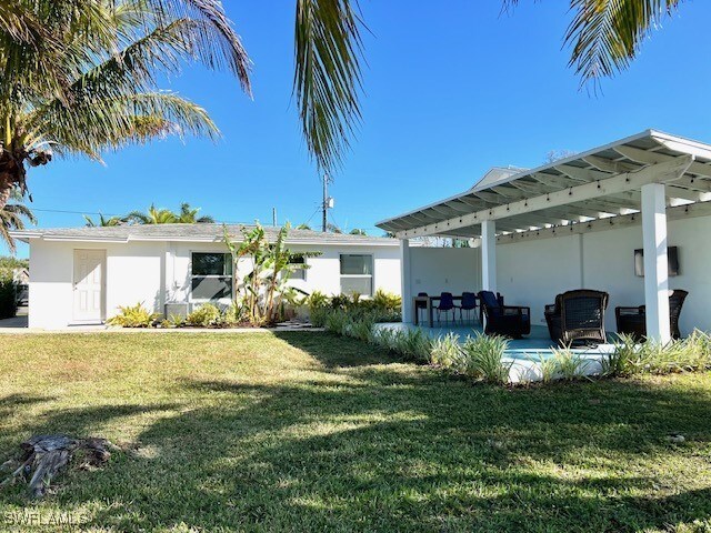 exterior space featuring a lawn and a patio