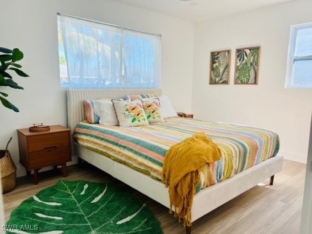 bedroom featuring wood-type flooring