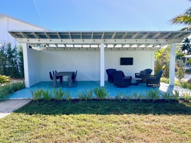 view of patio / terrace featuring a pergola and an outdoor hangout area