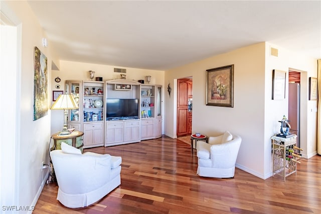 living room with dark hardwood / wood-style flooring