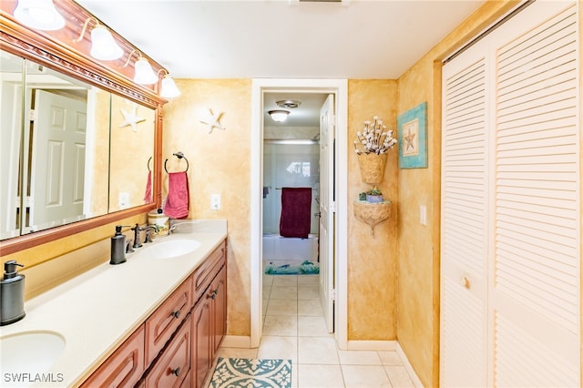 bathroom with tile patterned floors and vanity