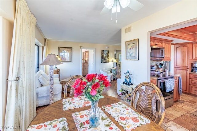 dining area featuring ceiling fan