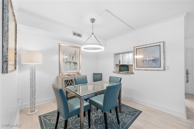 dining area with light hardwood / wood-style floors