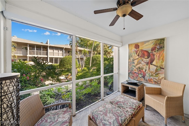 sitting room featuring ceiling fan