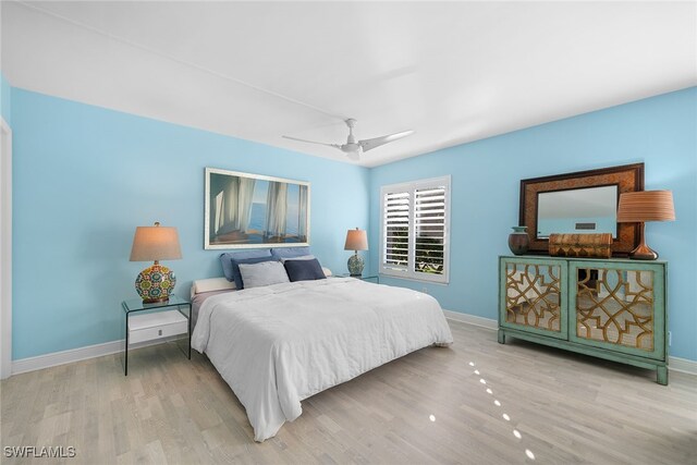 bedroom featuring ceiling fan and light hardwood / wood-style floors