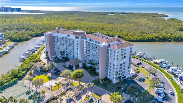 birds eye view of property with a water view