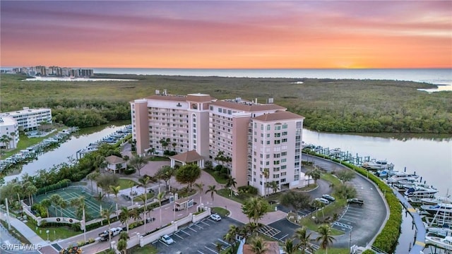 aerial view at dusk with a water view