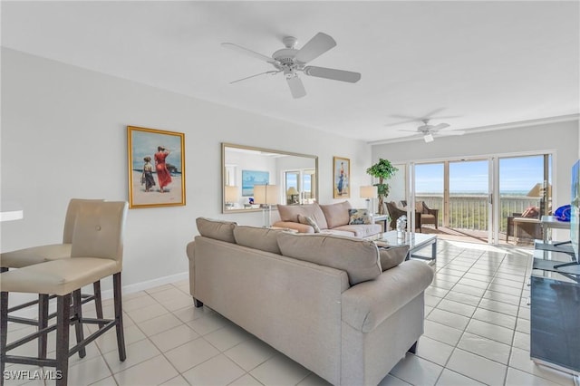 living room featuring ceiling fan and light tile patterned flooring