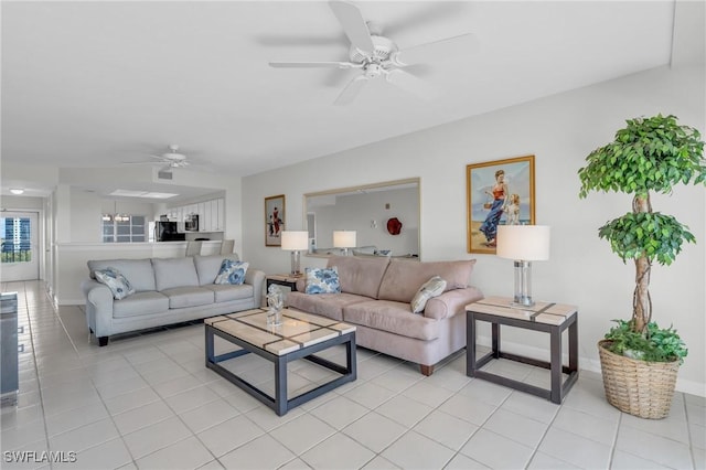 living room with ceiling fan and light tile patterned floors