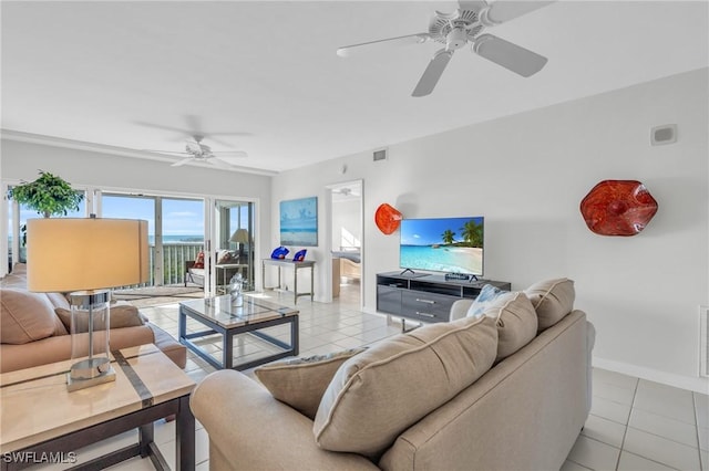 living room with ceiling fan and light tile patterned floors