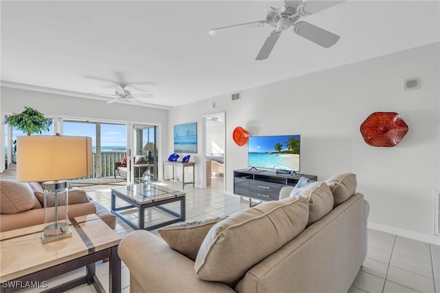 13105 Vanderbilt Dr Unit 802, Naples, FL 34110 - living area featuring ceiling fan, baseboards, and light tile patterned flooring