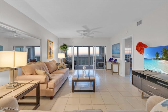 tiled living room with ceiling fan