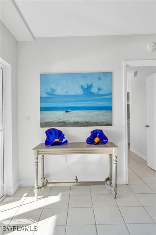 13105 Vanderbilt Dr Unit 802, Naples, FL 34110 - hall featuring tile patterned flooring and baseboards