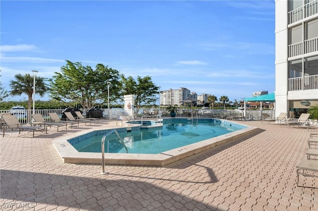 view of swimming pool featuring a patio