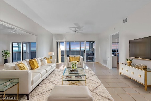 13105 Vanderbilt Dr Unit 802, Naples, FL 34110 - living area with a ceiling fan and light tile patterned floors