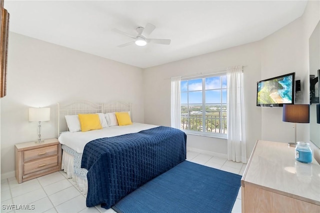 13105 Vanderbilt Dr Unit 802, Naples, FL 34110 - bedroom featuring light tile patterned floors, baseboards, and a ceiling fan