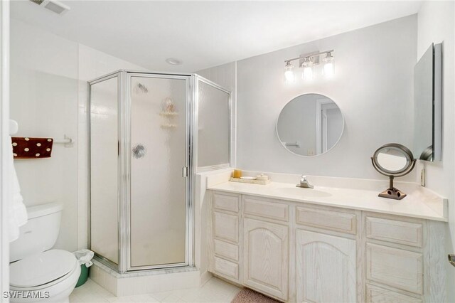 13105 Vanderbilt Dr Unit 802, Naples, FL 34110 - bathroom with a stall shower, toilet, and vanity