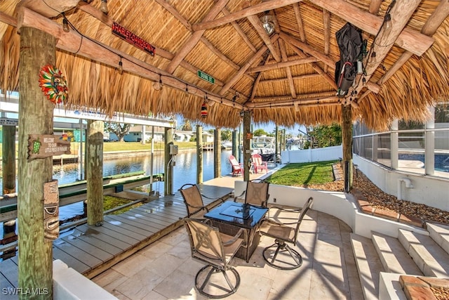 dock area featuring a gazebo and a water view