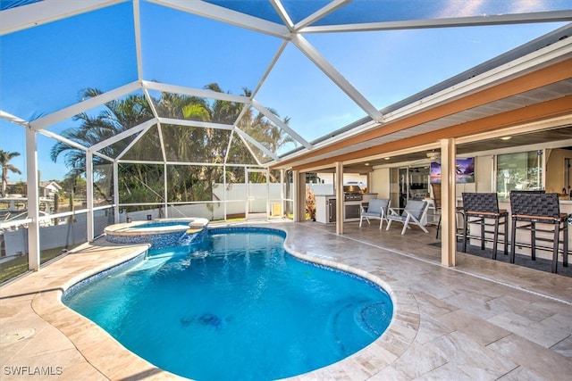 view of swimming pool with a patio area, an in ground hot tub, and glass enclosure