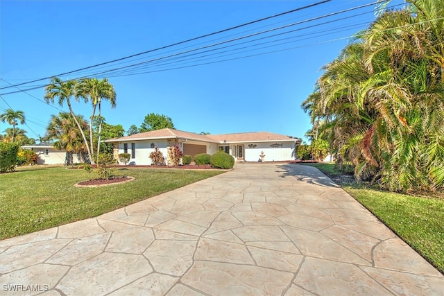 single story home featuring a front yard and a garage