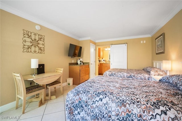 bedroom featuring a barn door, light tile patterned floors, baseboards, and ornamental molding