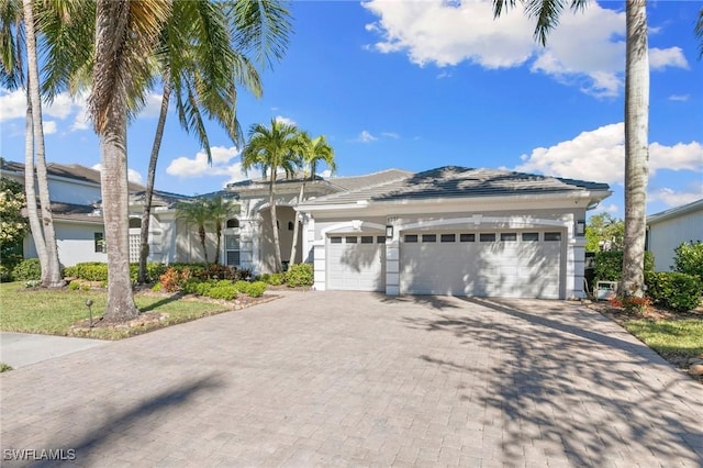 ranch-style home featuring a garage