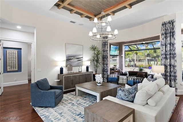 living room with a chandelier, wood-type flooring, and beamed ceiling