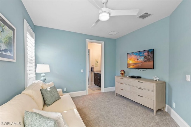 carpeted living room featuring ceiling fan