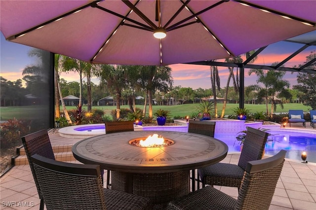 view of patio terrace at dusk