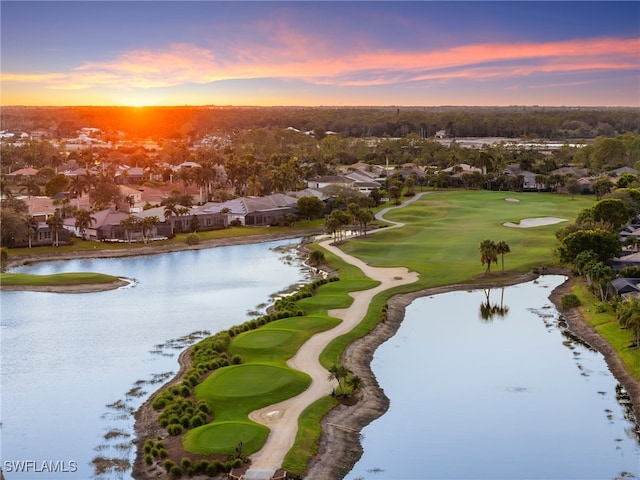 aerial view at dusk with a water view