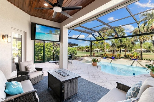 view of patio / terrace with an outdoor hangout area, ceiling fan, and a lanai