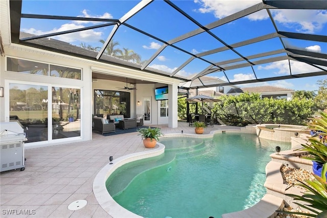 view of pool with ceiling fan, a lanai, an outdoor hangout area, an in ground hot tub, and a patio