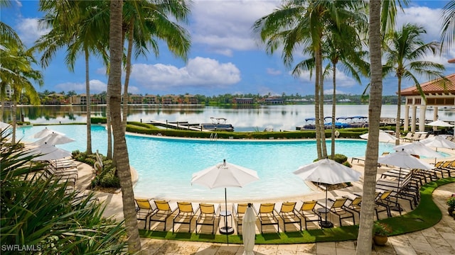 view of swimming pool with a water view