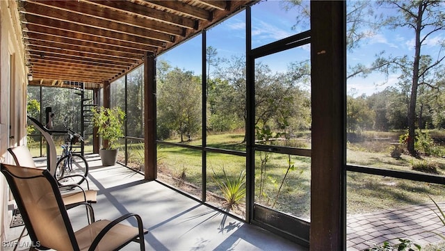 unfurnished sunroom with a wealth of natural light