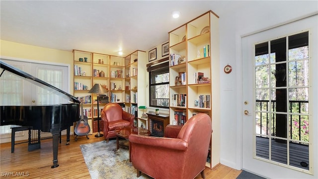 sitting room featuring light hardwood / wood-style floors