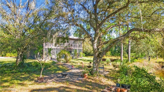 view of yard featuring a sunroom