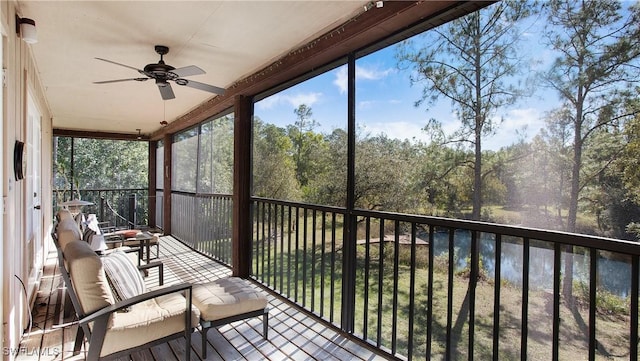 sunroom featuring ceiling fan