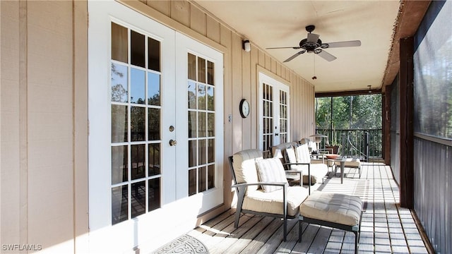 sunroom with a wealth of natural light, french doors, and ceiling fan