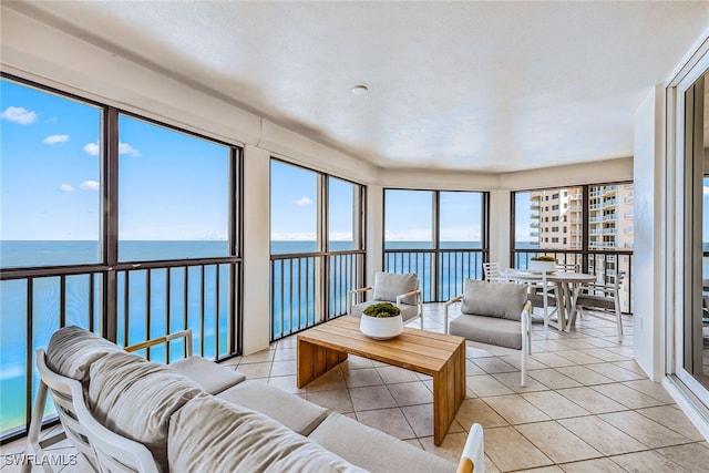 sunroom with a water view